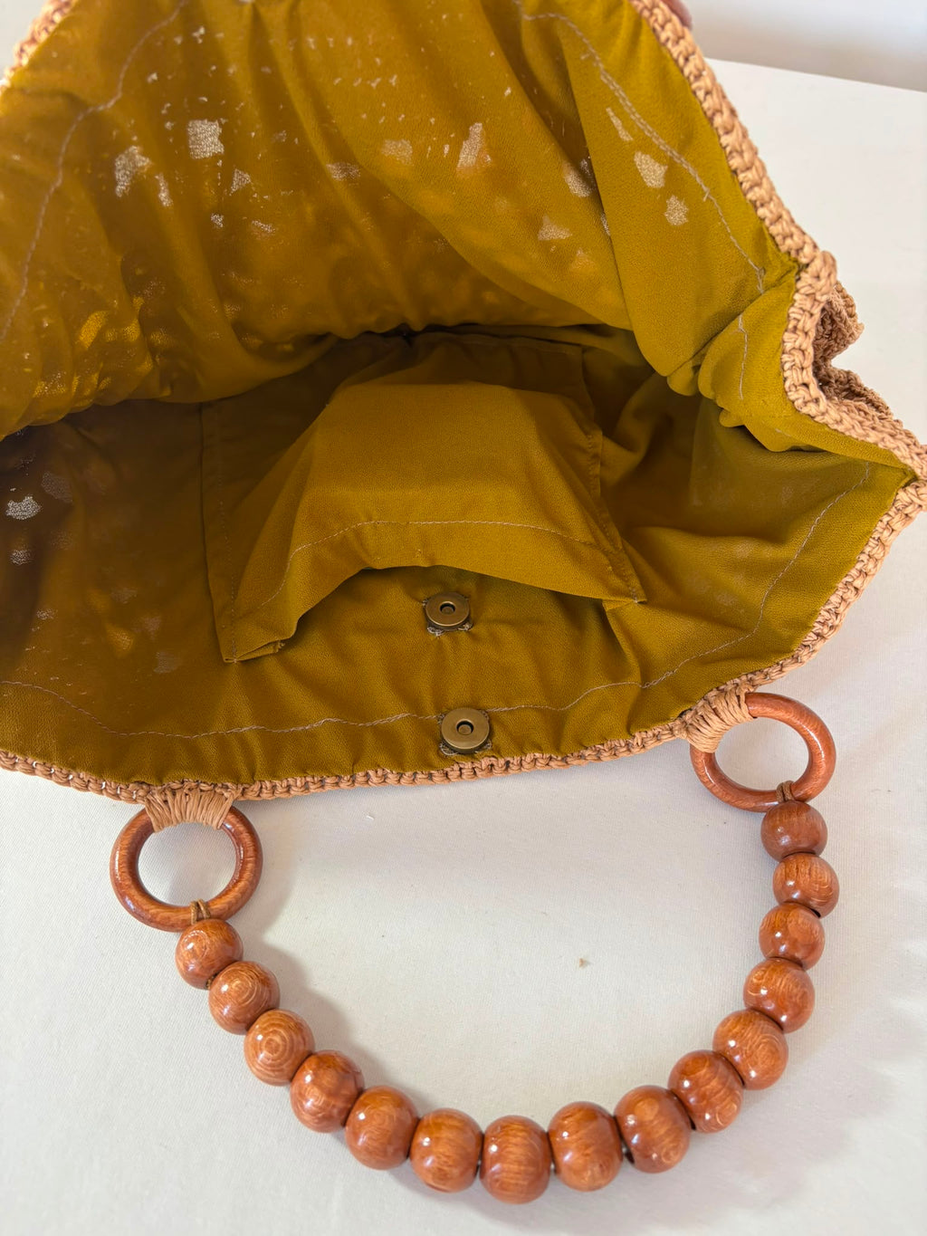One-of-a-kind raffia crochet handbag handmade with care, combining sustainable materials with modern boho fashion.