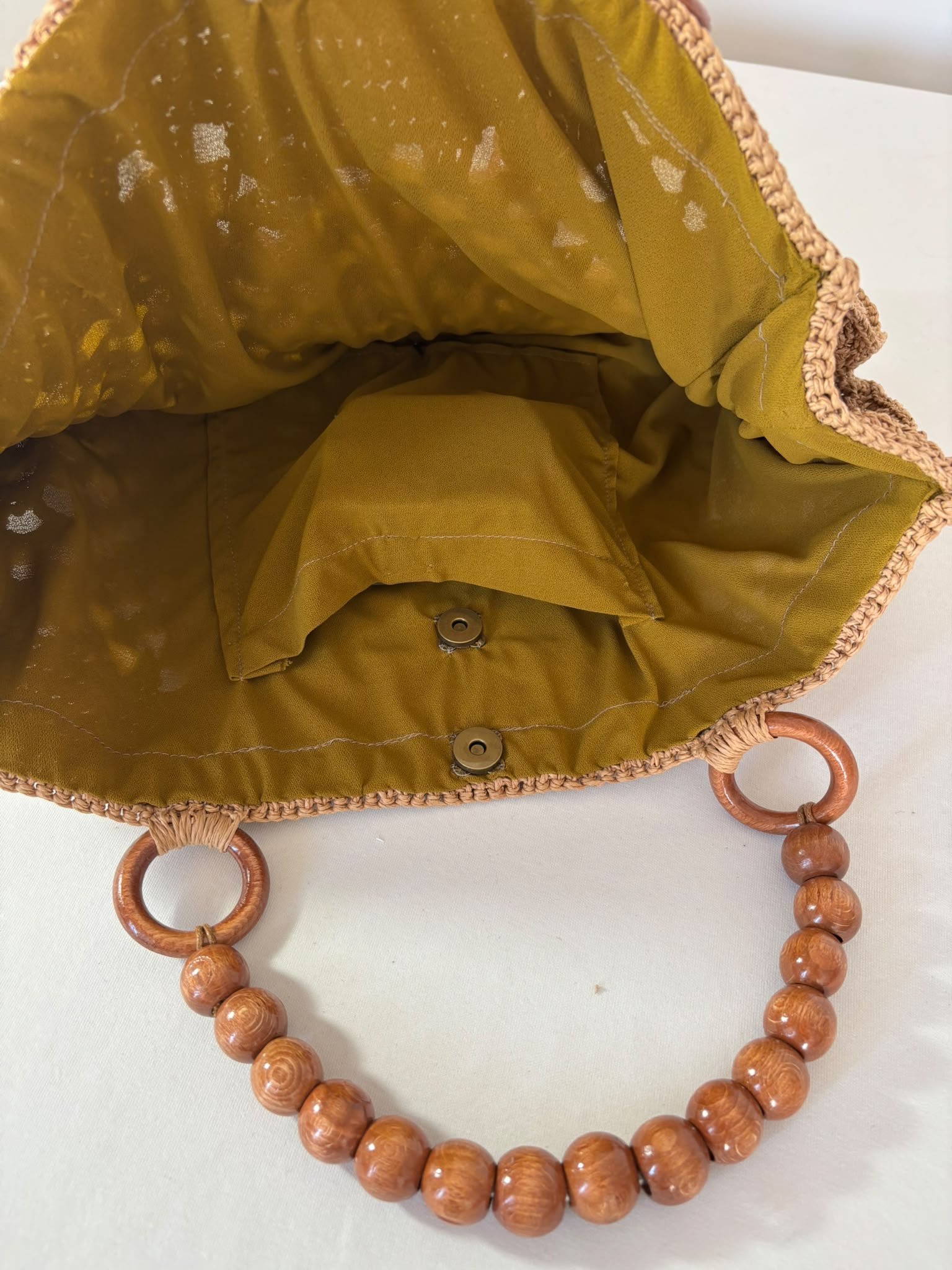 One-of-a-kind raffia crochet handbag handmade with care, combining sustainable materials with modern boho fashion.