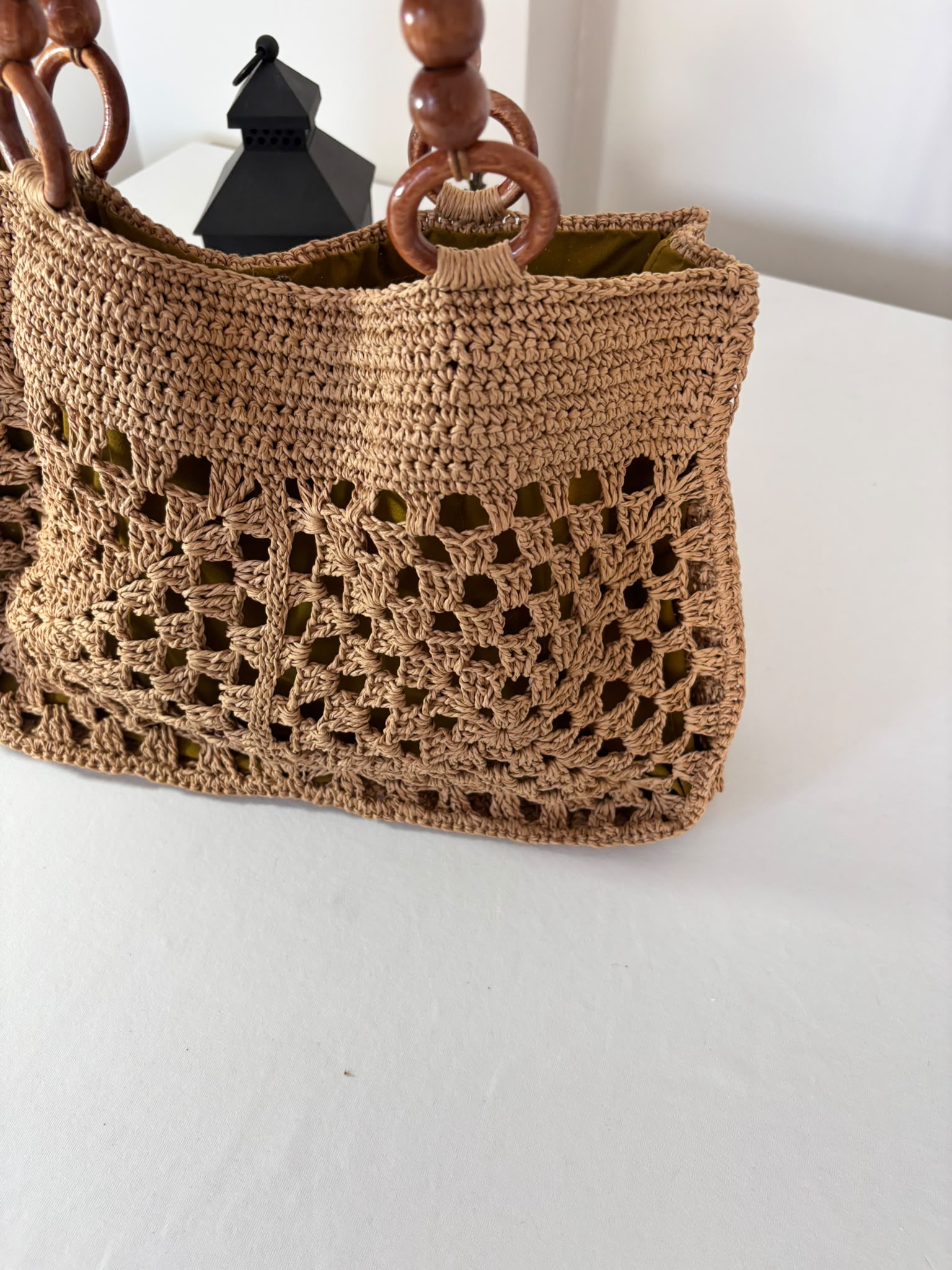 Eco-friendly raffia crochet bag made by hand, combining timeless bohemian design with practical everyday use.